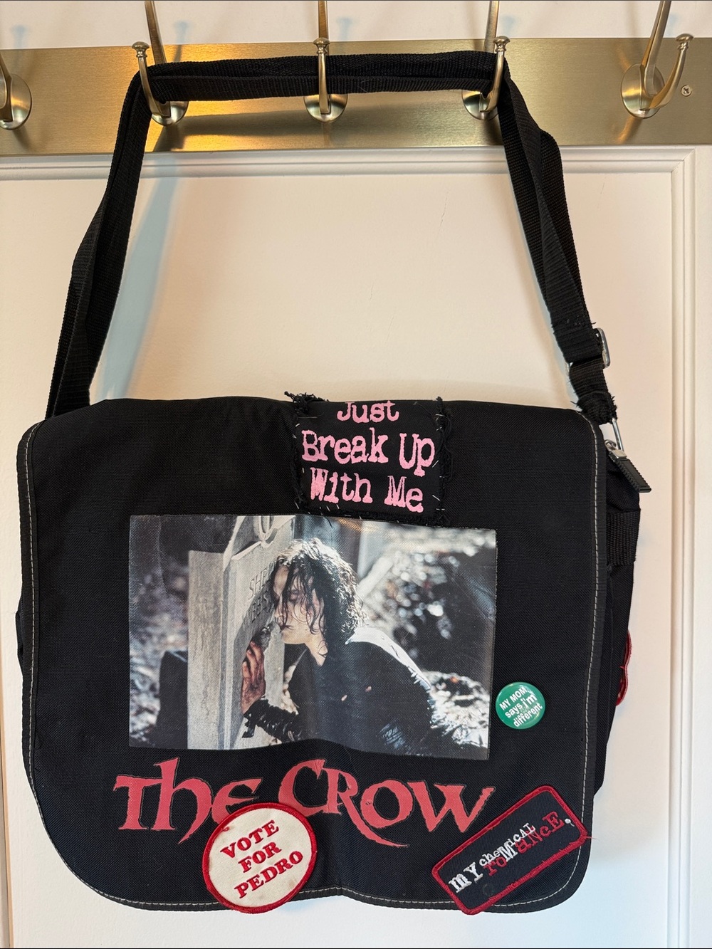 The Crow messenger bag with assorted patches.